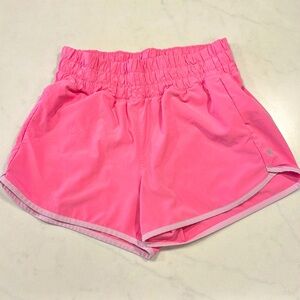 Athleta Girl Run Free 2.5” pink shorts, size 14 with pockets